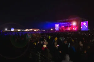 Simply Red playing on a lit stage to a night-time crowd at Lytham Festival
