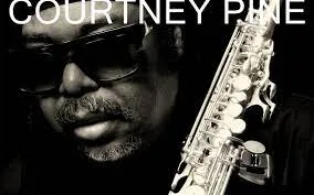 Courtney Pine in sunglasses holding a saxophone