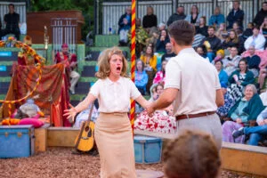 Two actors performing in an outdoor arena in A Midsummer Night's Dream at Storyhouse