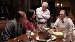 Still from Killers of the Flower Moon: four people at a dinner table