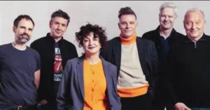Deacon Blue, six band members, posing against a white wall