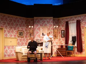 Two actors in a floral-wallpapered living room set in Lost Soul 2 at the Royal Court