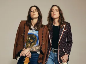 Larkin Poe, the two sisters, in patterned blazers