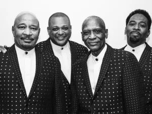 The Stylistics, four members in polka-dot jackets, in black and white