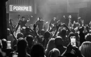Crowd and band at a Porkpie gig at Liverpool's O2 Academy, in black and white