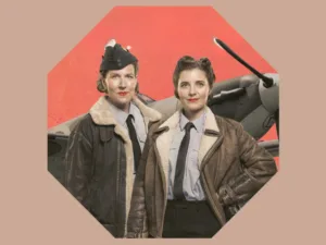 Spitfire Girls artwork: two women in wartime flying jackets in front of a Spitfire