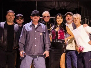Happy Mondays line-up posing together backstage
