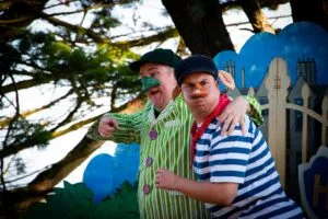 Two actors in striped costumes in Illyria's The Wind in the Willows at Claremont Farm