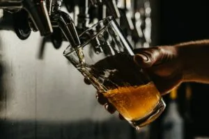 Beer being poured from a tap into a pint glass