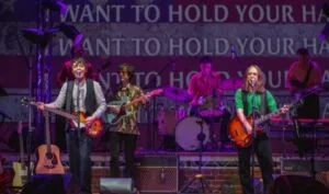 Come Together band performing Beatles songs on stage at the Royal Court